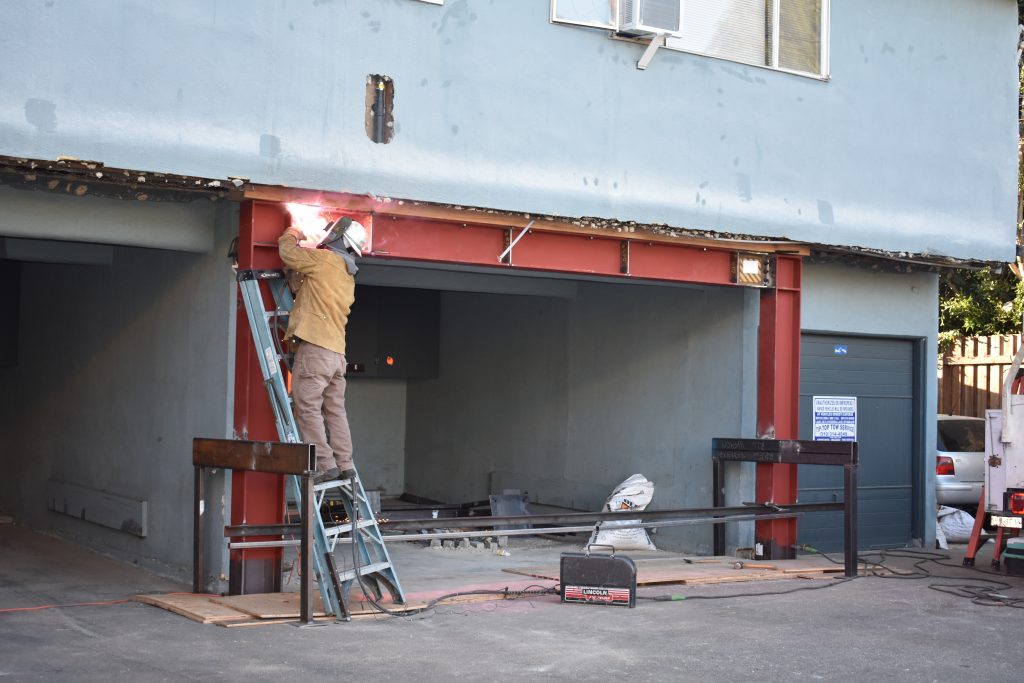 construction workers working on a soft-story retrofit