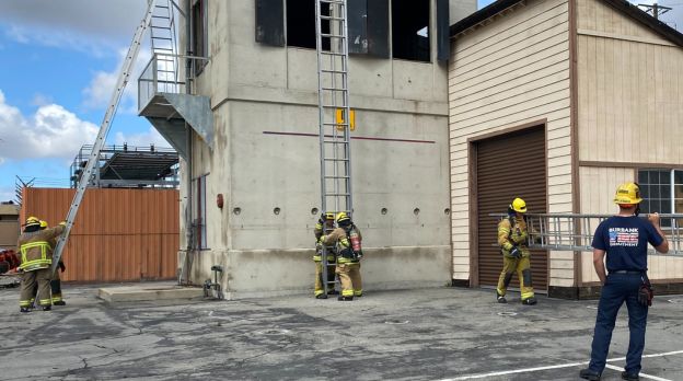 Firefighter training facility with several firefighters