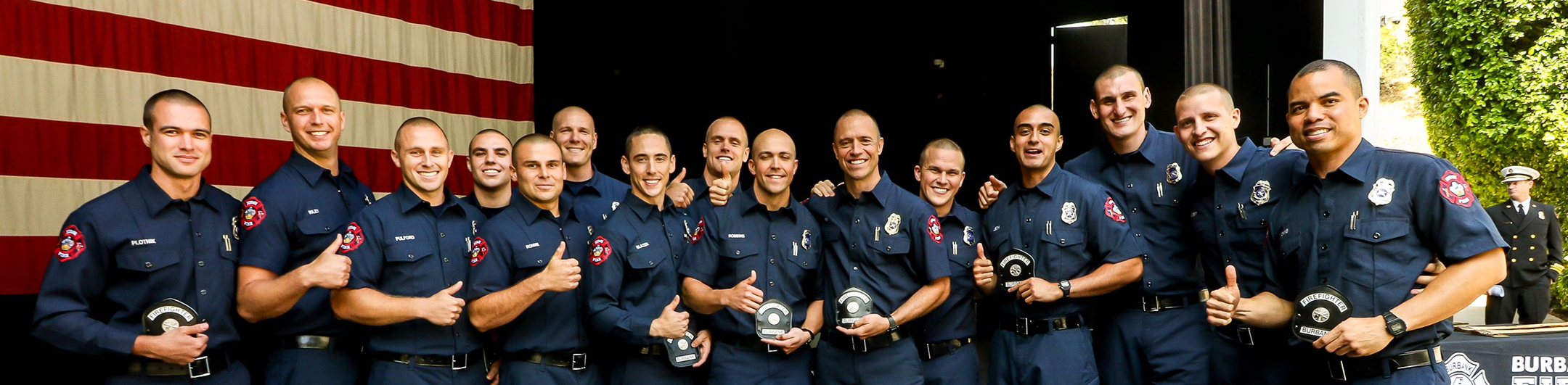 group of smiling Burbank firemen