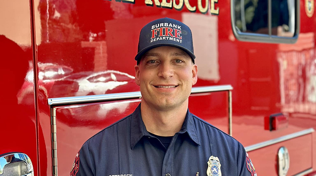 firefighter smiling at the camera