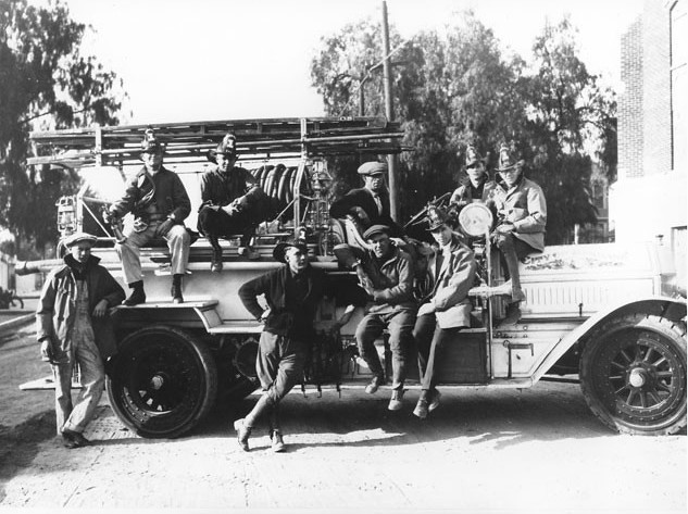 Historical black and white photo of Burbank firefighters on an old fire truck