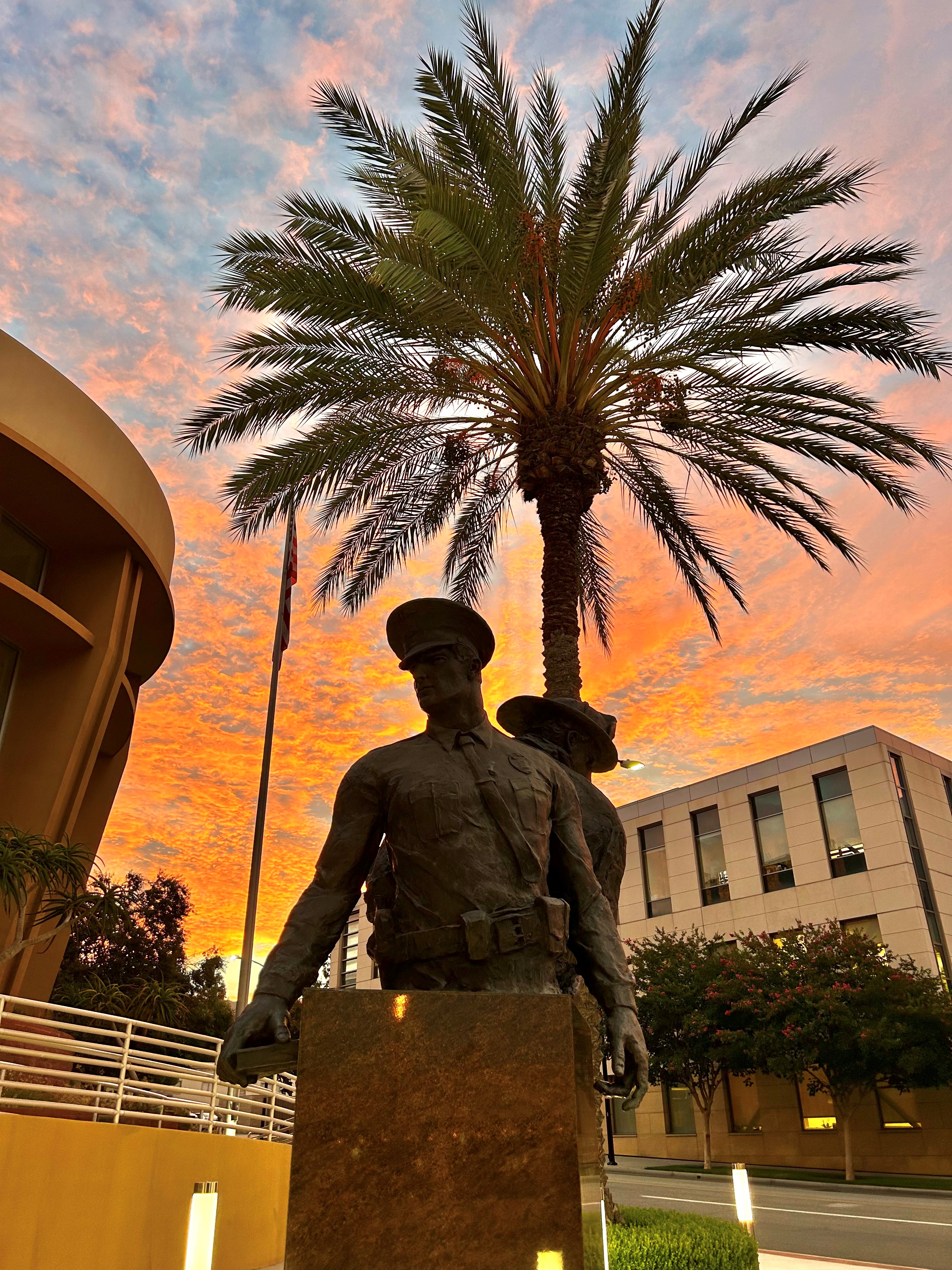 Sunset view of statues in front of Burbank police headquarters