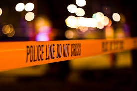 Nighttime view of police line do not cross tape