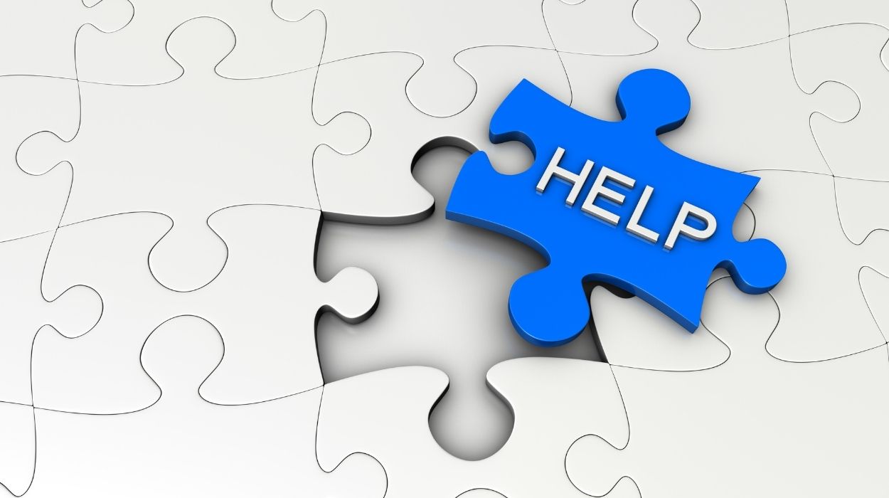 Puzzle pieces, one with the word help