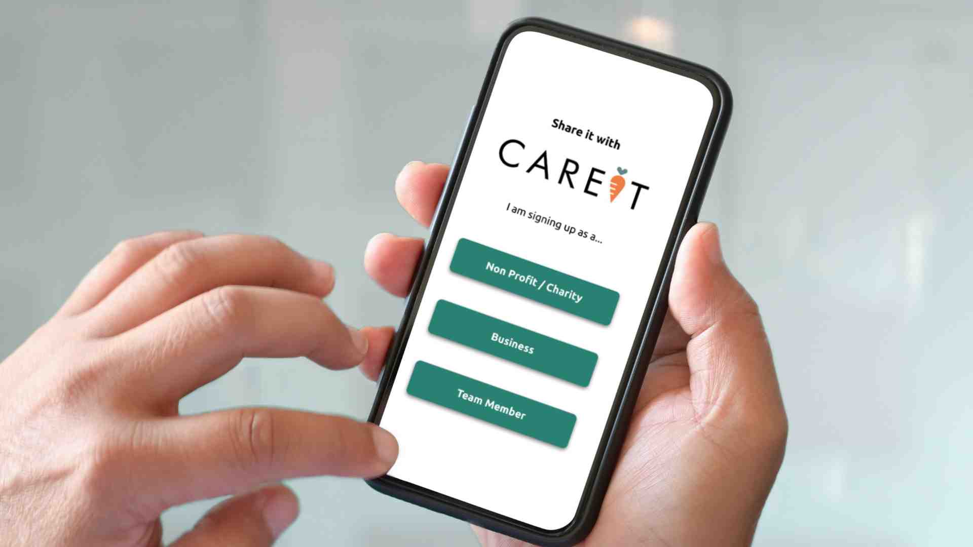 A close-up on a pair of hands holding a smartphone with the "CAREIT" app on the screen.