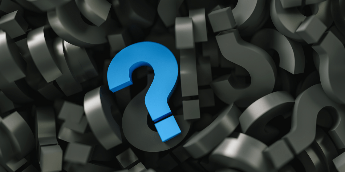 An image of a blue question mark in the middle of a muddling of grey question marks.
